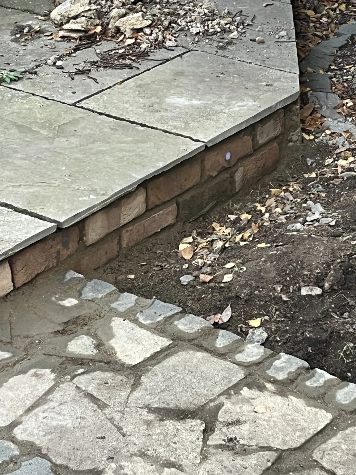 Brick slips and a recessed LED fitted into the patio edge in daylight