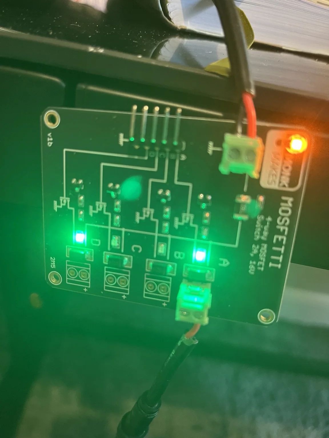 The Mosfetti four-channel MOSFET driver with indicator lights illuminated during testing